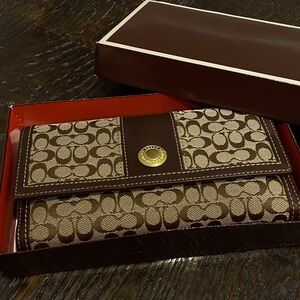 COACH Ergo signature checkbook wallet.